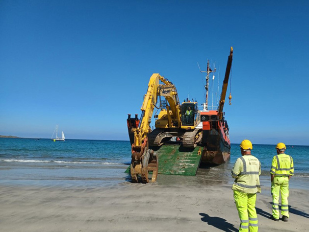 Digger Arriving On The Beach